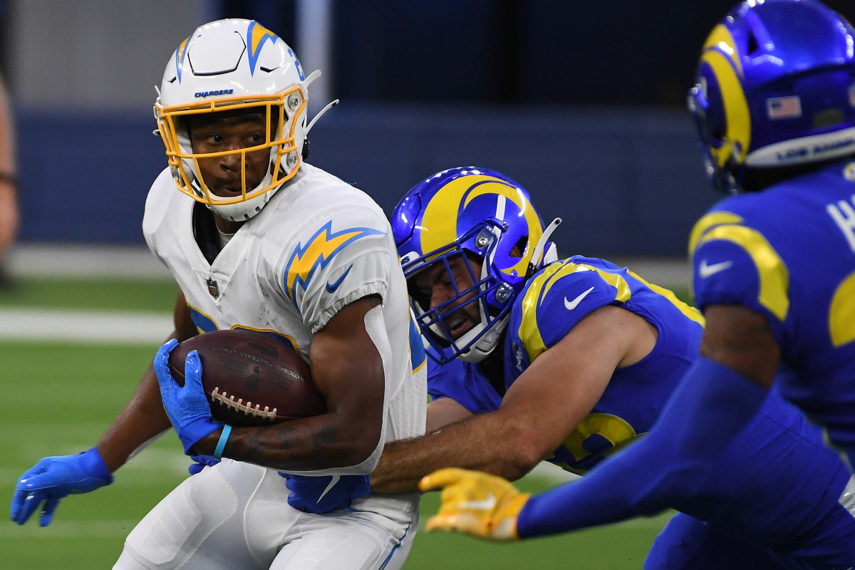 Aug 14, 2021; Inglewood, California, USA; Los Angeles Rams linebacker Justin Lawler (53, center) and defensive back Brontae Harris (35, right) defend against Los Angeles Chargers running back Justin Jackson (22) in the first quarter at SoFi Stadium. Mandatory Credit: Richard Mackson-USA TODAY Sports